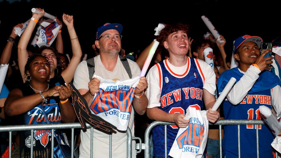 Kicks fans watching a game in the streets