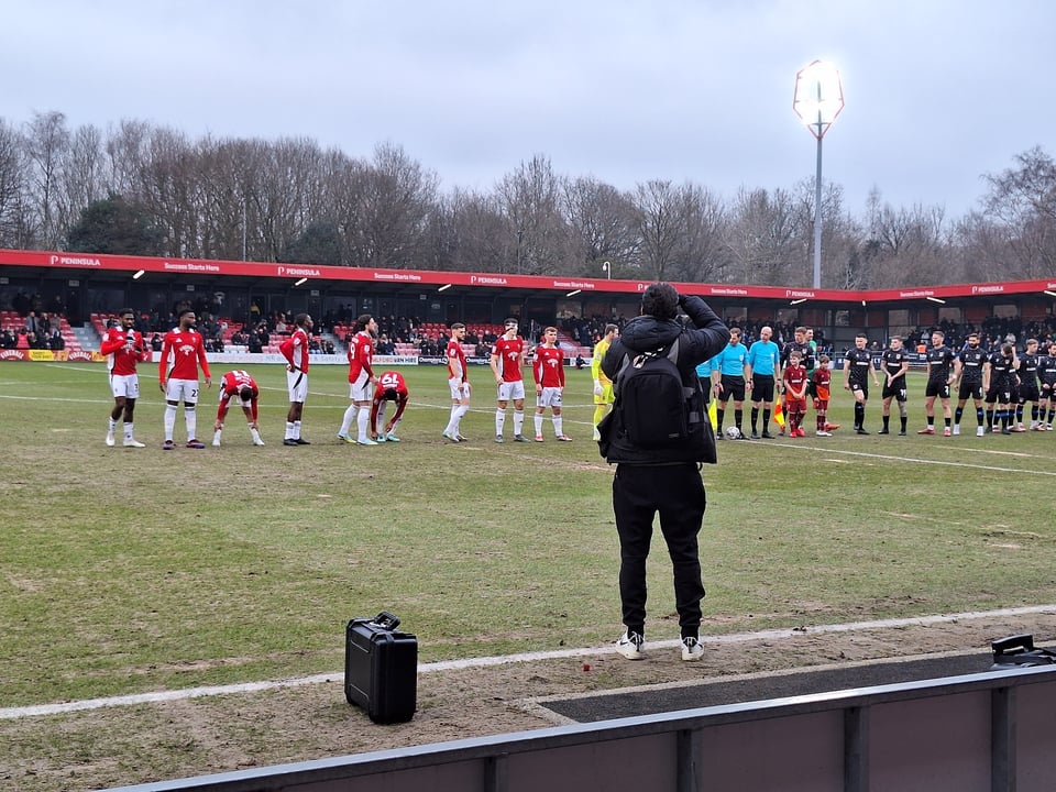 Pre-match handshake at Salford City