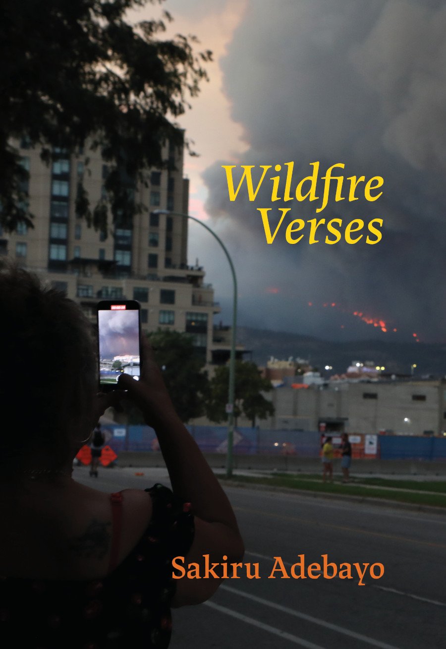Person in Kelowna, BC taking a cell phone photo of a wildfire
