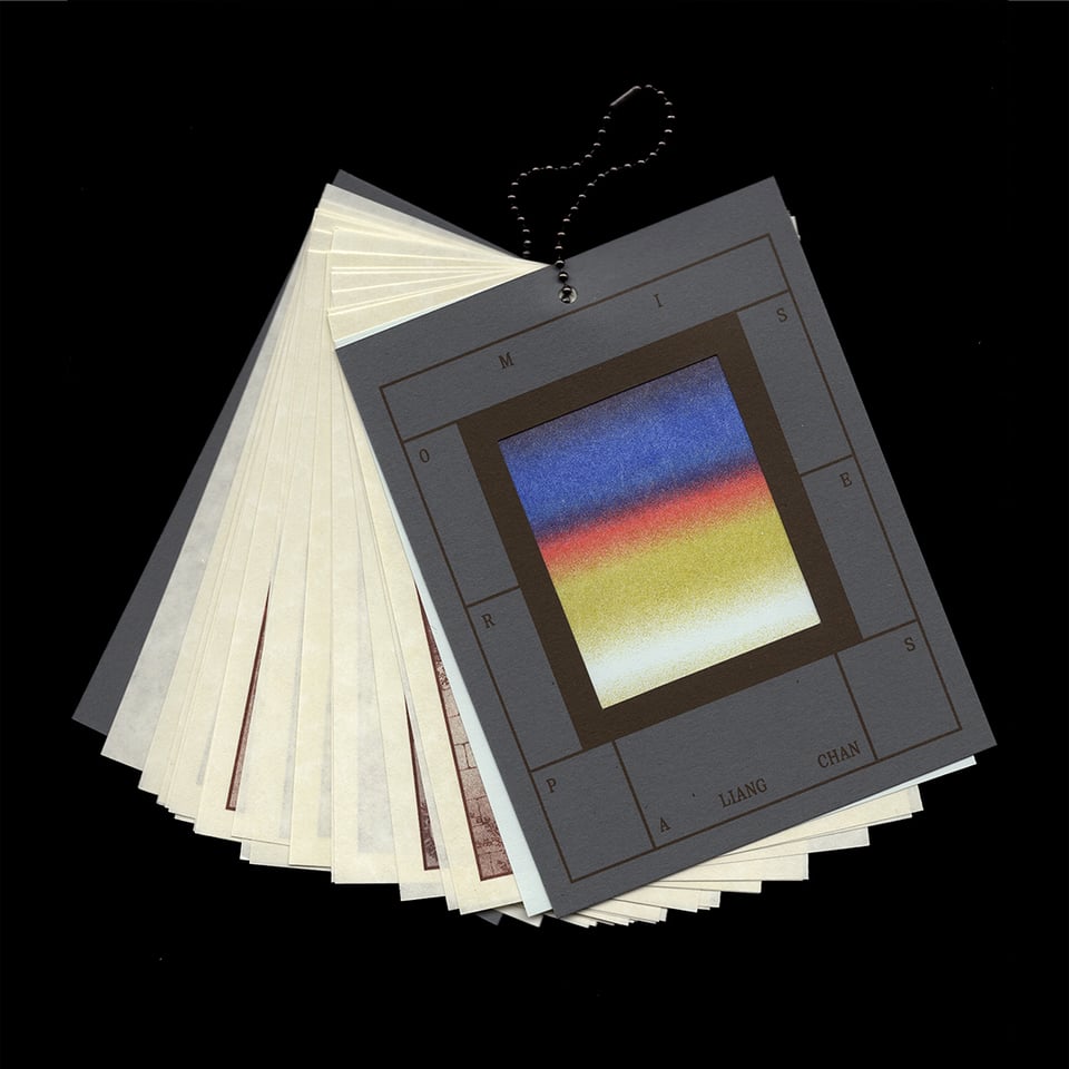 a zine bound with a loop of ball chain like a ring of flashcards, with dark grey covers and "PROMISES" "A Liang Chan" arranged in a grid around a cutout to a colorful gradient. Lighter pages with brown ink are fanned out beneath.