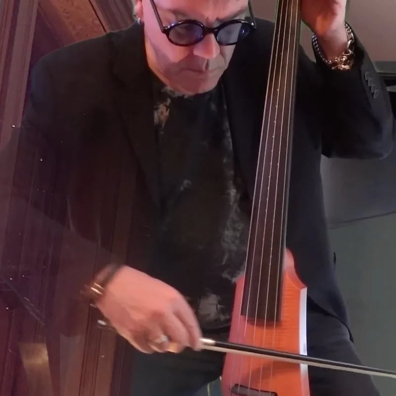 Blake playing an electric cello