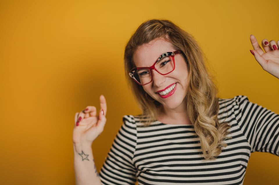 Photo of Dr. Kate smiling and dancing