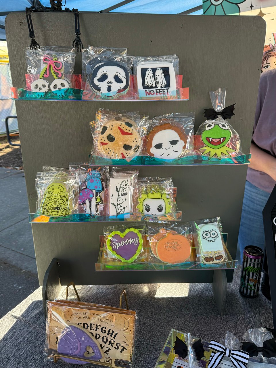 A display of Halloween-themed cookies, including a Ghostface mask and a Polly Pocket in the shape of a pumpkin