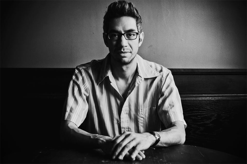 Black and white portrait of owner David Moo at Quarter Bar in Park Slope, Brooklyn, 2009