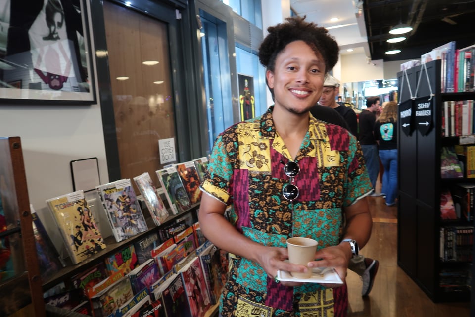 man standing in comic book shop