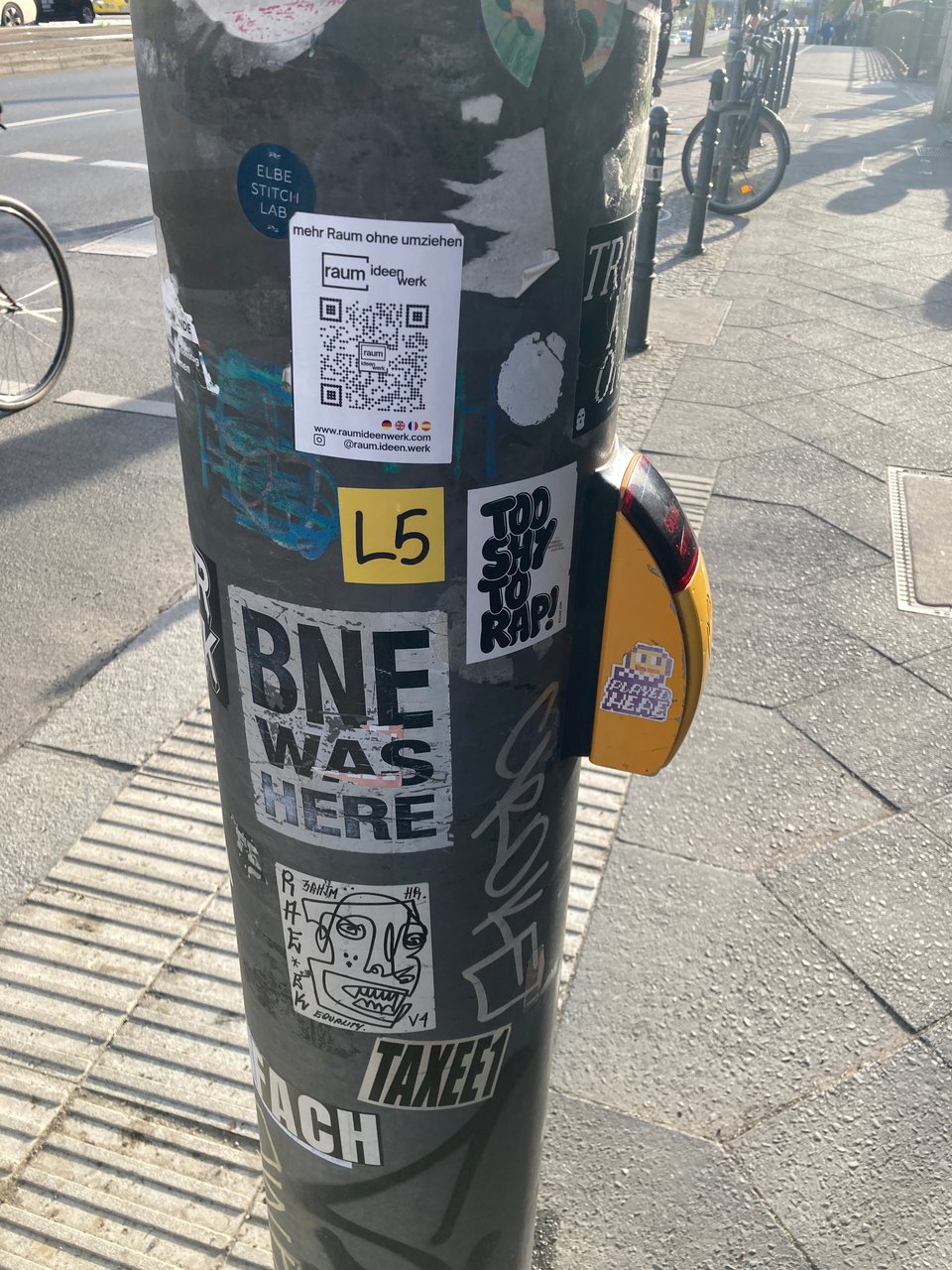 graff stickers on a pole