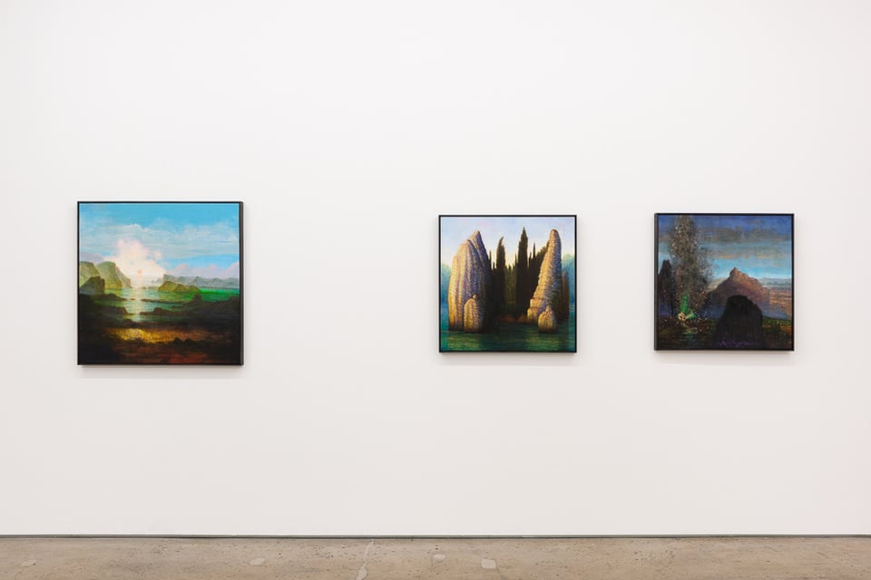 three dreamy landscape paintings on a white gallery wall