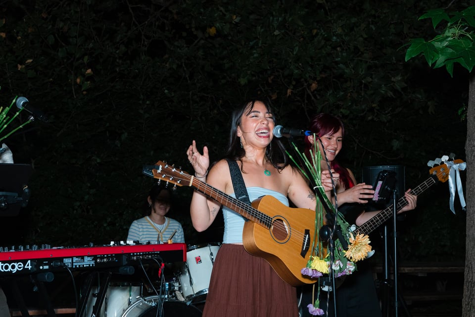 Leah Nawy laughs into the mic