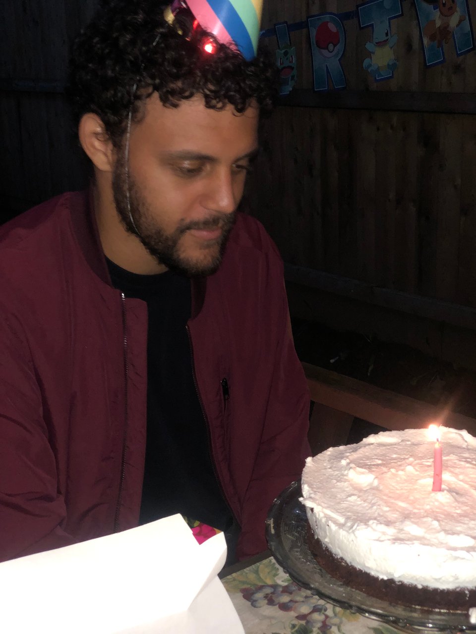 me despondently staring at my flourless chocolate birthday cake.