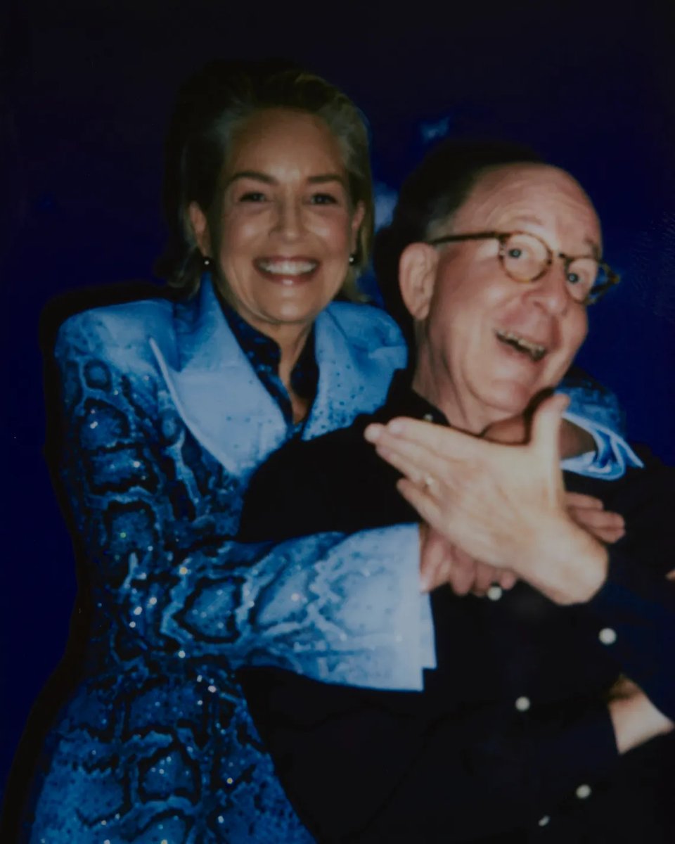 Photo by Chantal Anderson of actor/artist Sharon Stone hugging art critic Jerry Saltz.