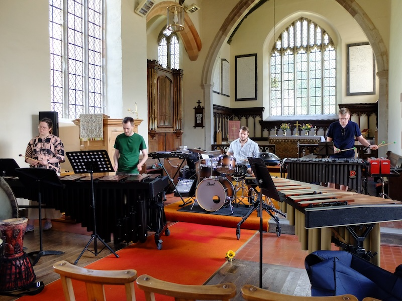 A group of musicians with percussion