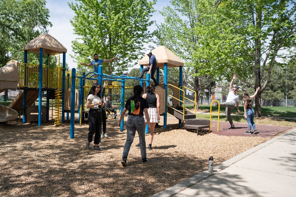 A group hanging out at a playground.