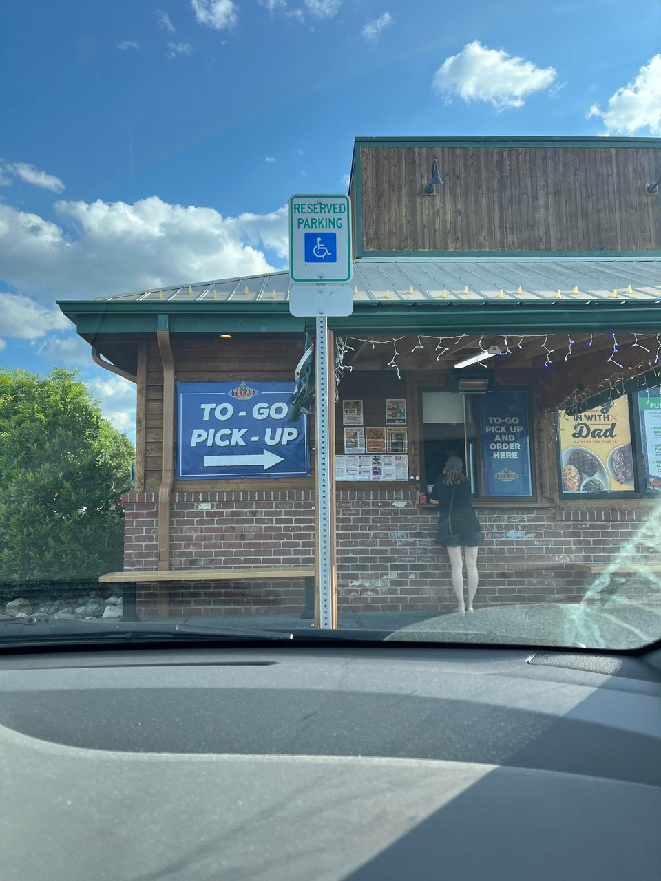 The to-go pick-up at the Frederick Texas Roadhouse, seen from the front seat of my mom's car
