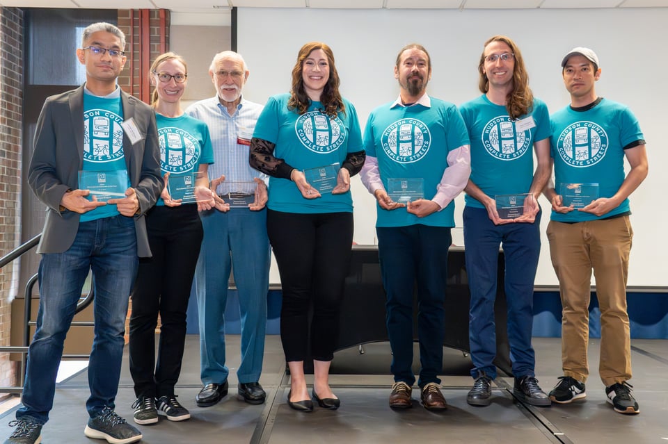 a group of people holding awards