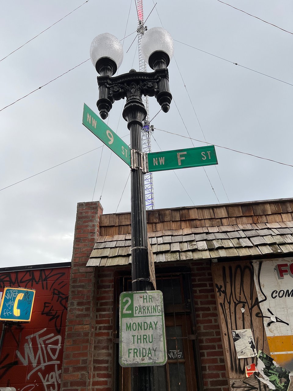 Street signs on a lamppost.