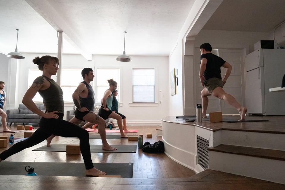 People doing yoga with Dan.