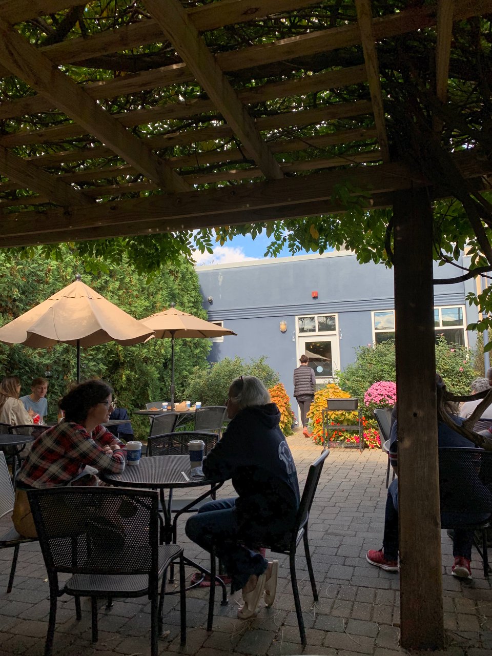 A busy summer day at Seven Stars patio on Hope Street, lots of greenery and flowers
