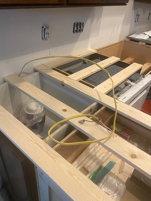 Adding support boards to cabinets for the countertops for an unknown important reason