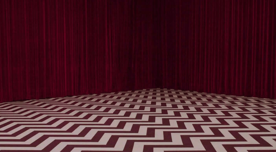 The iconic Red Room from Twin Peaks, a dreamscape with deep red curtains and a zigzag pattern on the floor