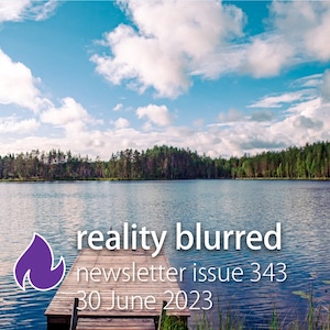 A small dock on a lake; trees are in the distance and fluffy white clouds in the sky, with the text 'reality blurred newsletter issue 343, 30 June 2023'