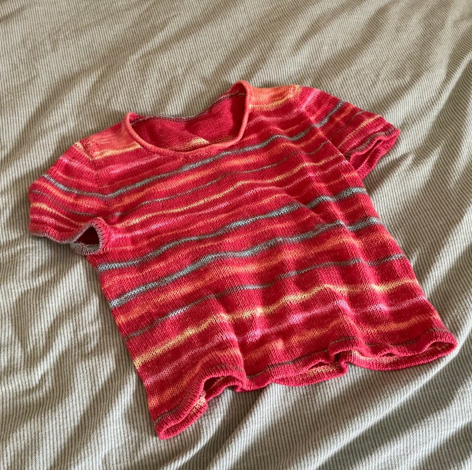 Handknit red teeshirt with yellow and blue stripes