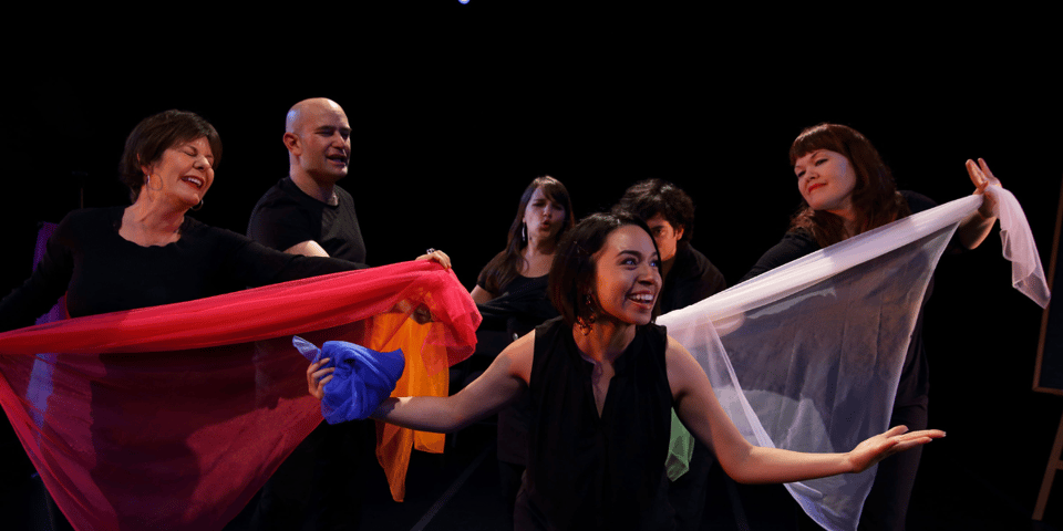 Playback theatre performers use coloured cloth in their performance.