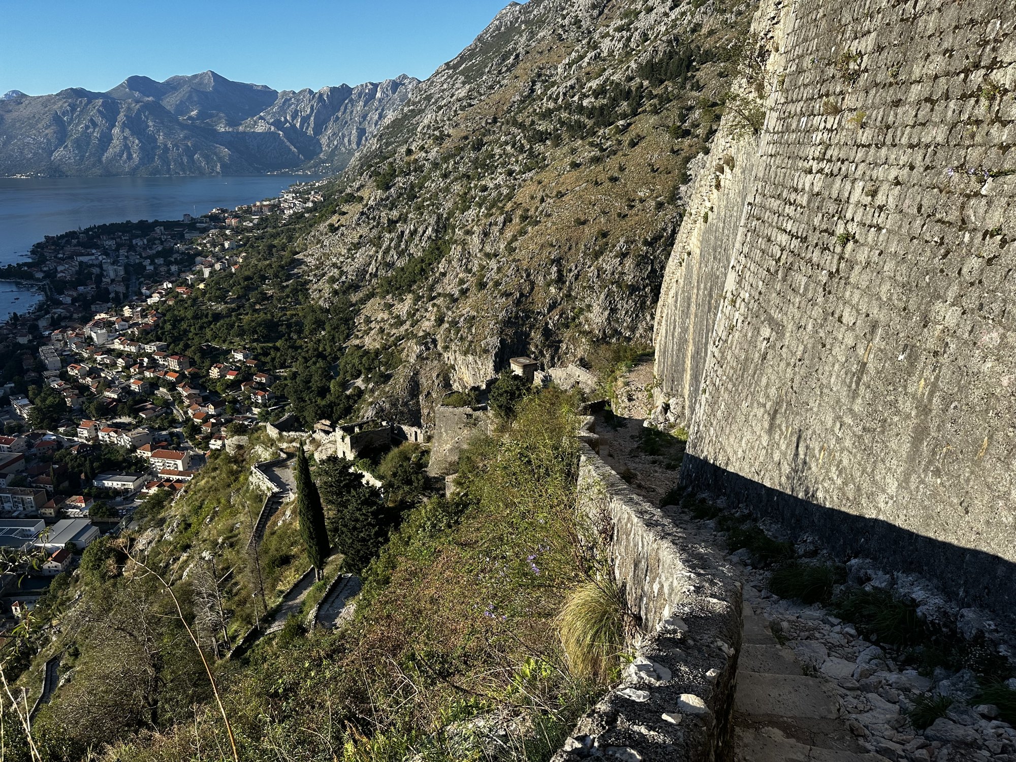 Kotor's Venetian walls zig-zagging up the cliff above the bay