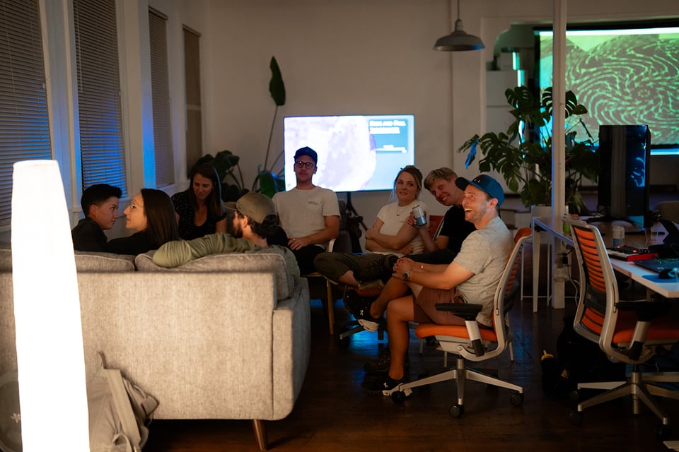 A different group of people at couches and chairs.
