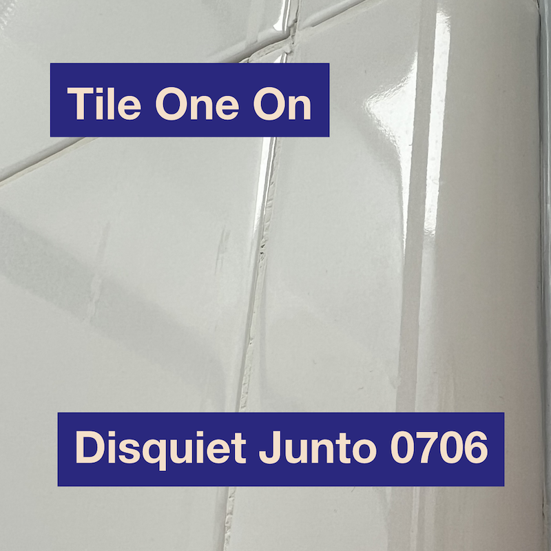 A photo of white bathroom tile plus the name and number of the project