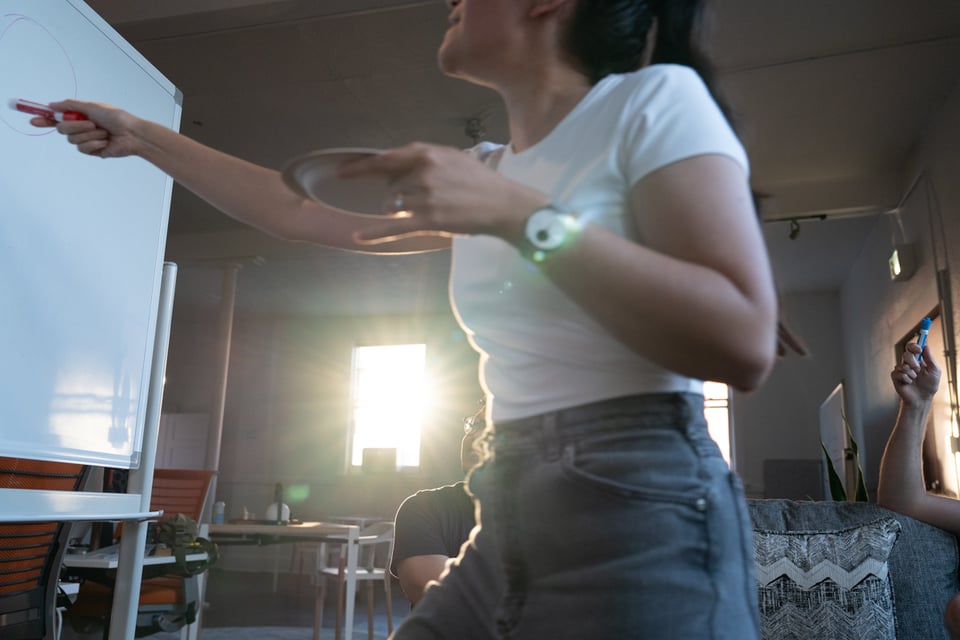 Livvy pointing at a drawing.