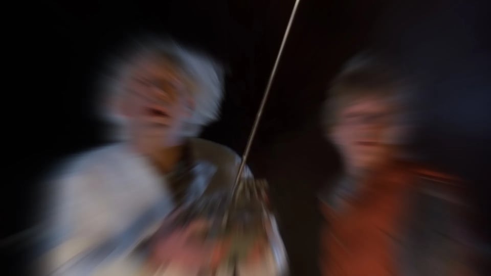 A blurred picture of Doc and Marty from Back to the Future