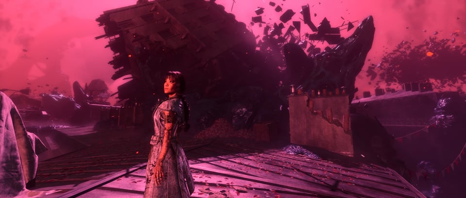 a woman standing in front of a wrecked building
