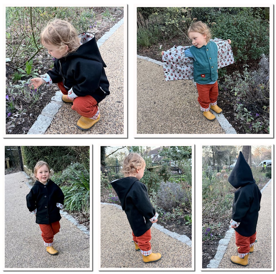 Black pixie coat modelled by young boy