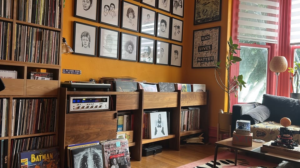 A room with lots of records in it. And a very sick looking plant. I fucking suck at plants.