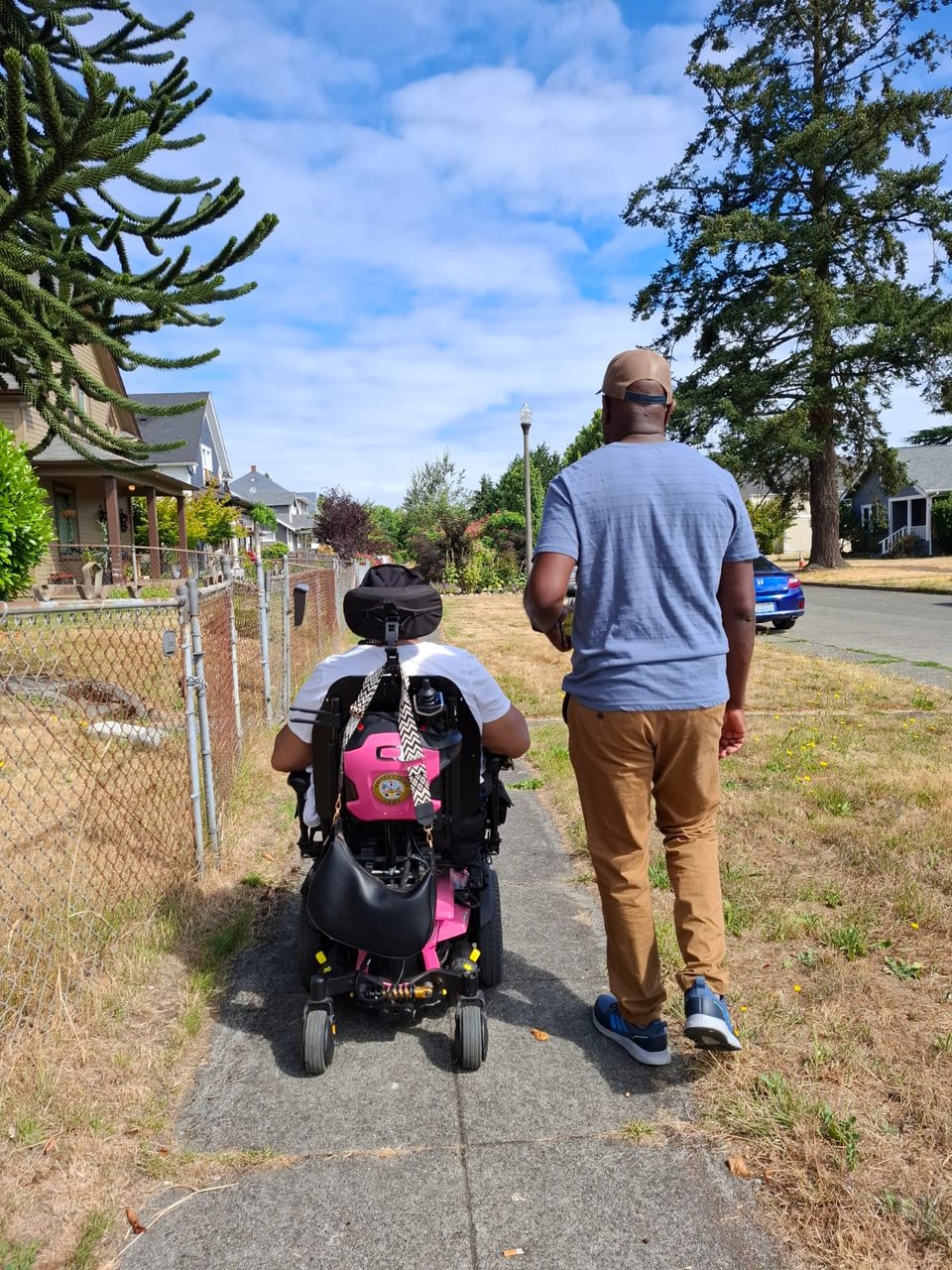 Mom in her power chair. I am walking next to her.