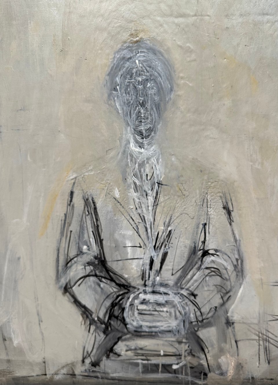photo of painting/drawing by Alberto Giacometti of Isaku Yanaihara, in which the face looks to have been scraped away multiple times and what's left is a strange mix of gray and white paint that implies the unknowability of another person