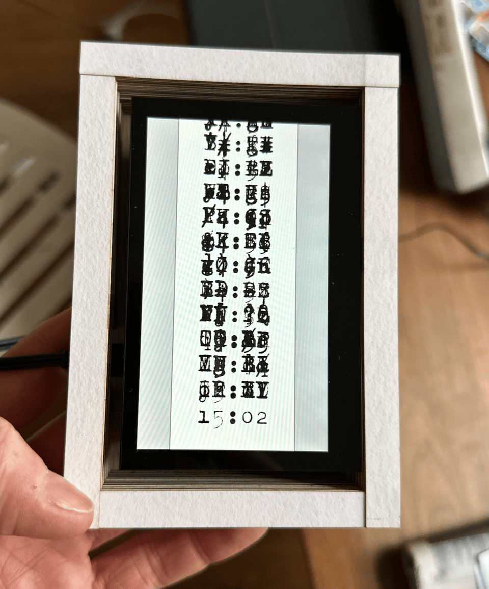 Photo of the Clock object by Vasilis van Gemert, showing LTR NCND as the typewriter face.