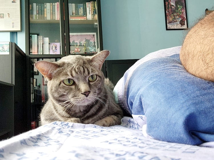 Luca sitting next to me on my bed