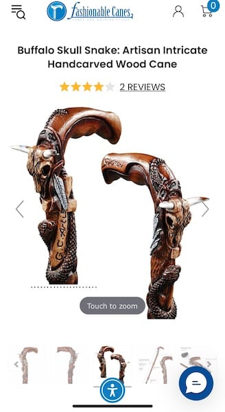 A wood cane will ALL of the Western motifs: gun holster, cow skull, snake, feather