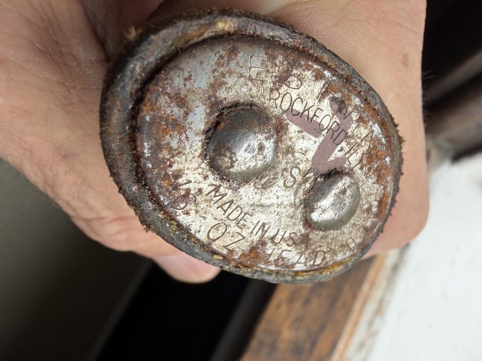 Close-up of the Estwing hammer butt plate stamped ESTWING, ROCKFORD-ILL., MADE IN U.S.A., 16 OZ HEAD - no ZIP code and no patent number