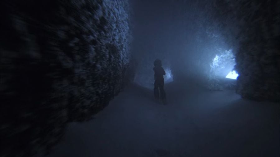 Danny runs through the hedge maze. Now the hedges are dusted with snow and a thick layer covers the ground.