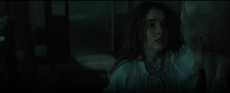 Brynn, in her night gown and with her shoulder length brown hair sticking to her sweaty face, stares in disbelief at the Grey she has just accidentally stabbed in the head with the broken piece from a diorama school house.