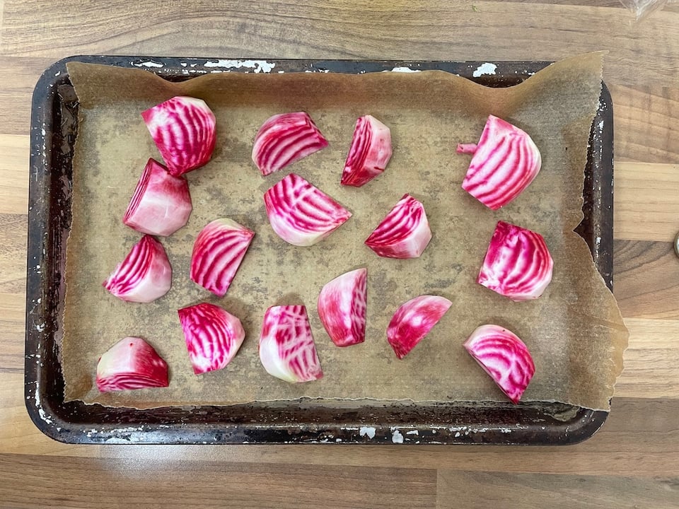 Raw candy striped beets on a sheet tray