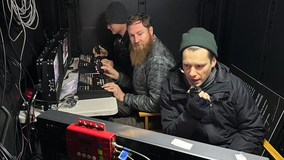 video control room in operatioon with three crew members inside