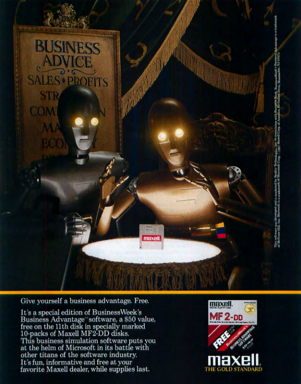 A silver robot stands behind a gold robot, with the gold robot standing over a glowing tabletop. Standing on the table is a 3.5" floppy disk. Behind both robots is a fortune-teller-esque sign that says "Business Advice: Sales/Profits..." the rest of the text is obscured behind the silver robot.
