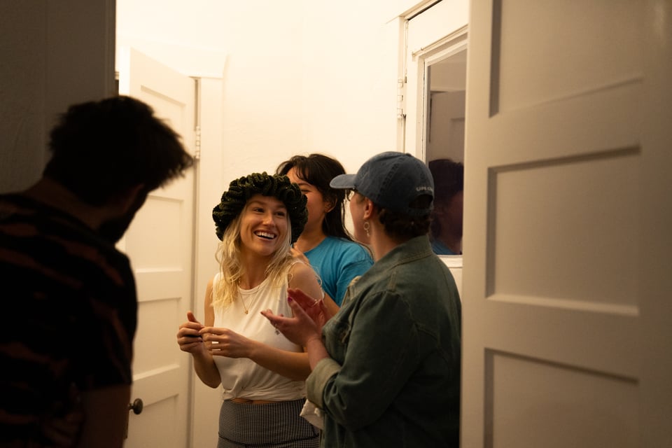 Halie thoroughly enjoying wearing an amazing hat.