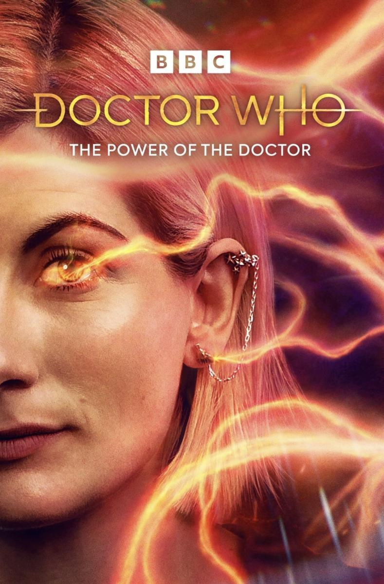 A closeup on the left side of the 13th Doctor's face, her eye glowing with regeneration energy that's whipping about everywhere.
