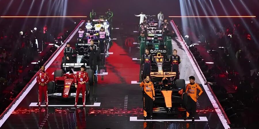 All 10 team cars are lined up as if on a starting grid, with all 20 drivers standing around looking awkward.