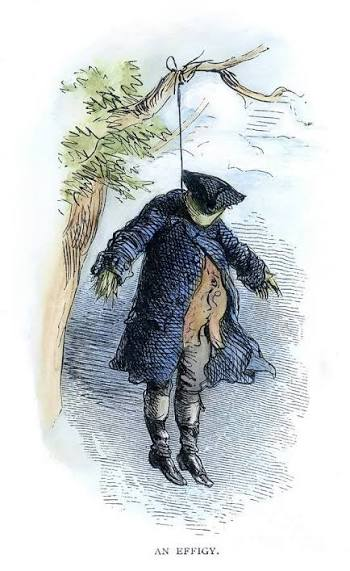 A 1770s cartoon sketch of an effigy hanging by its neck on an elm tree, with the words "An Effigy." on the bottom.