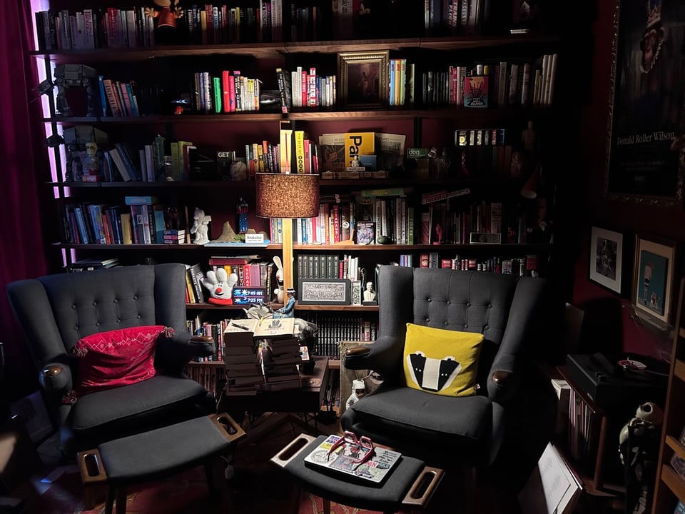 Our very excellent library with lots of books and to Papa Bear chairs.